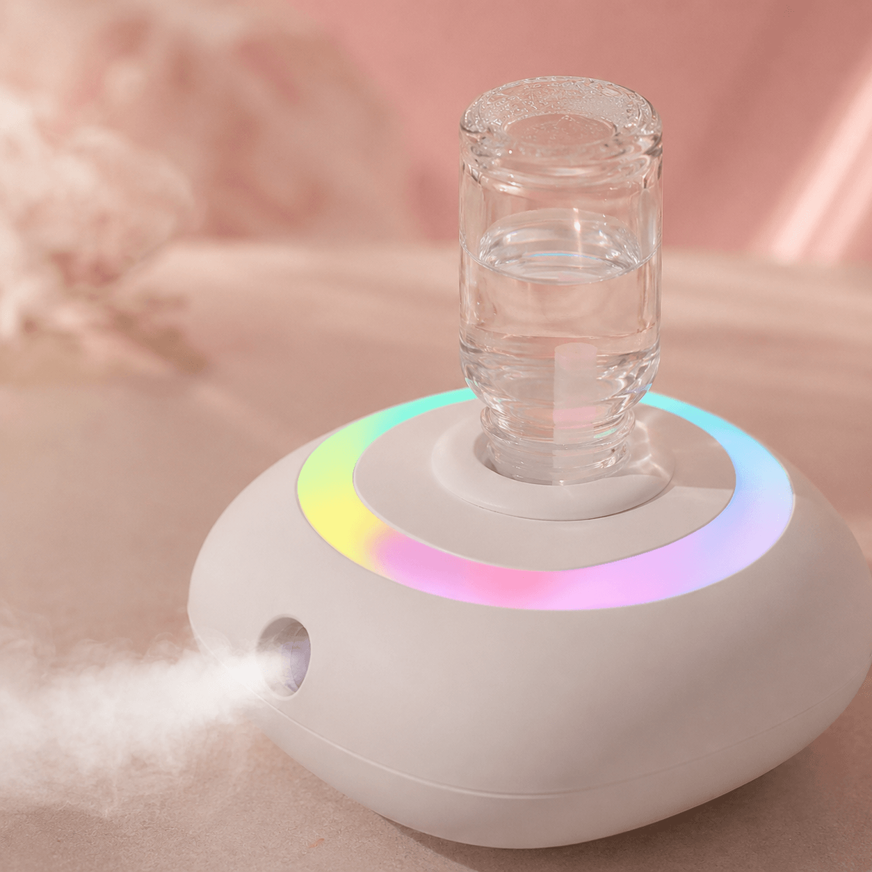 Detail view of a rainbow diffuser with colorful ring light and visible mist
