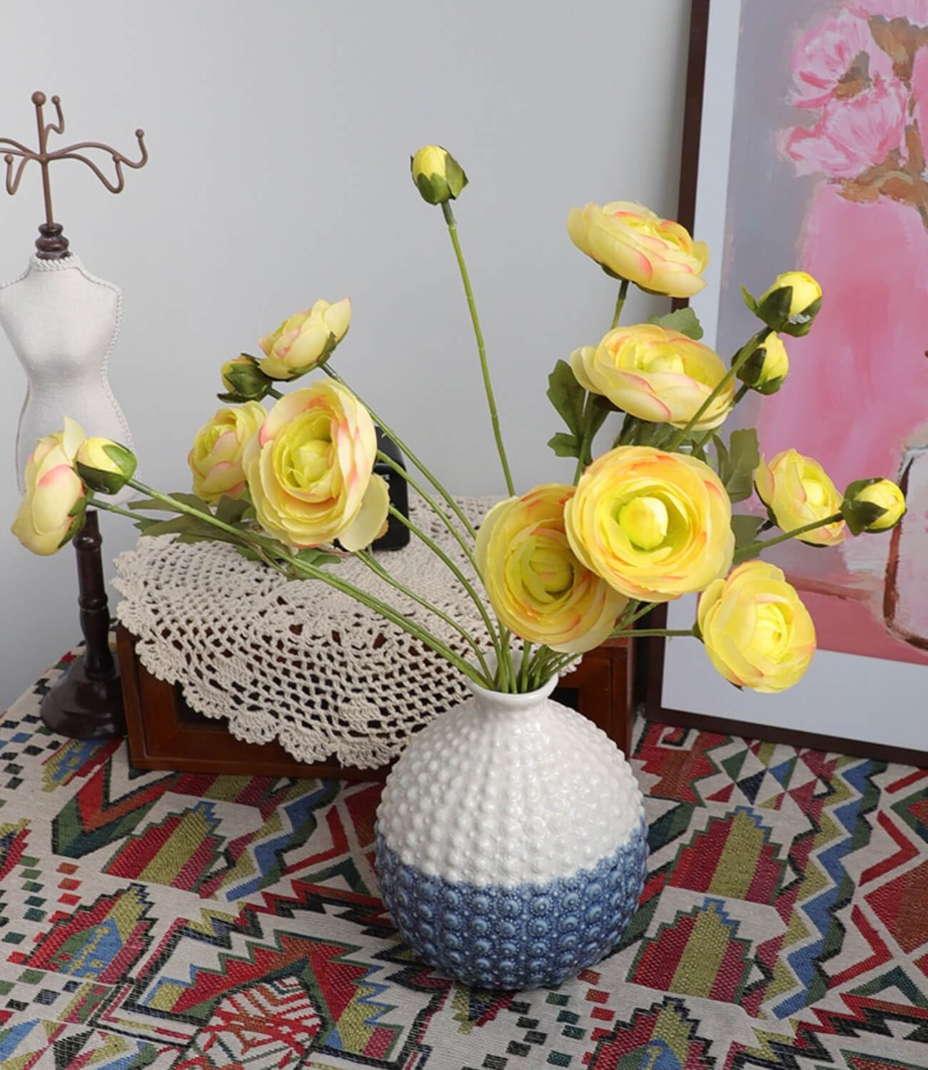 An artistic ceramic vase, blooming with a gentle sea of flowers, dreamlike and enchanting.