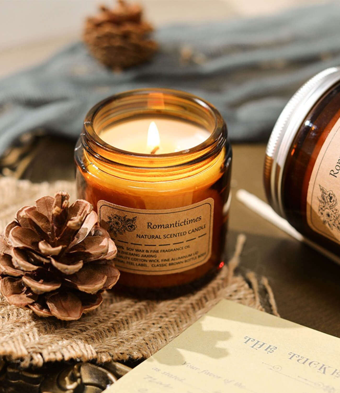 Aromatic ambiance created by a vintage-style scented candle, casting a warm glow in the room.