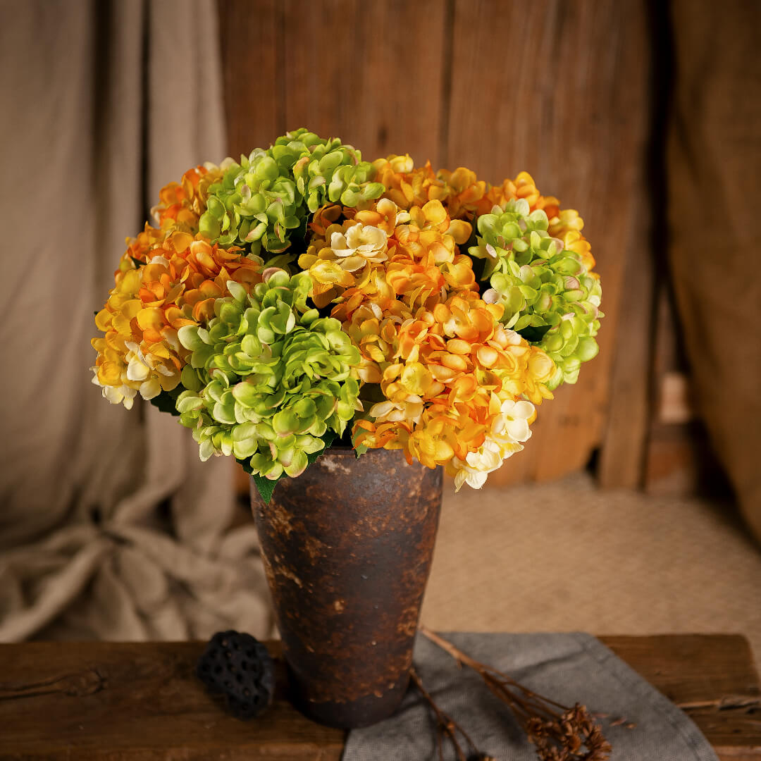 Hydrangea arrangement in vase, fresh and charming.