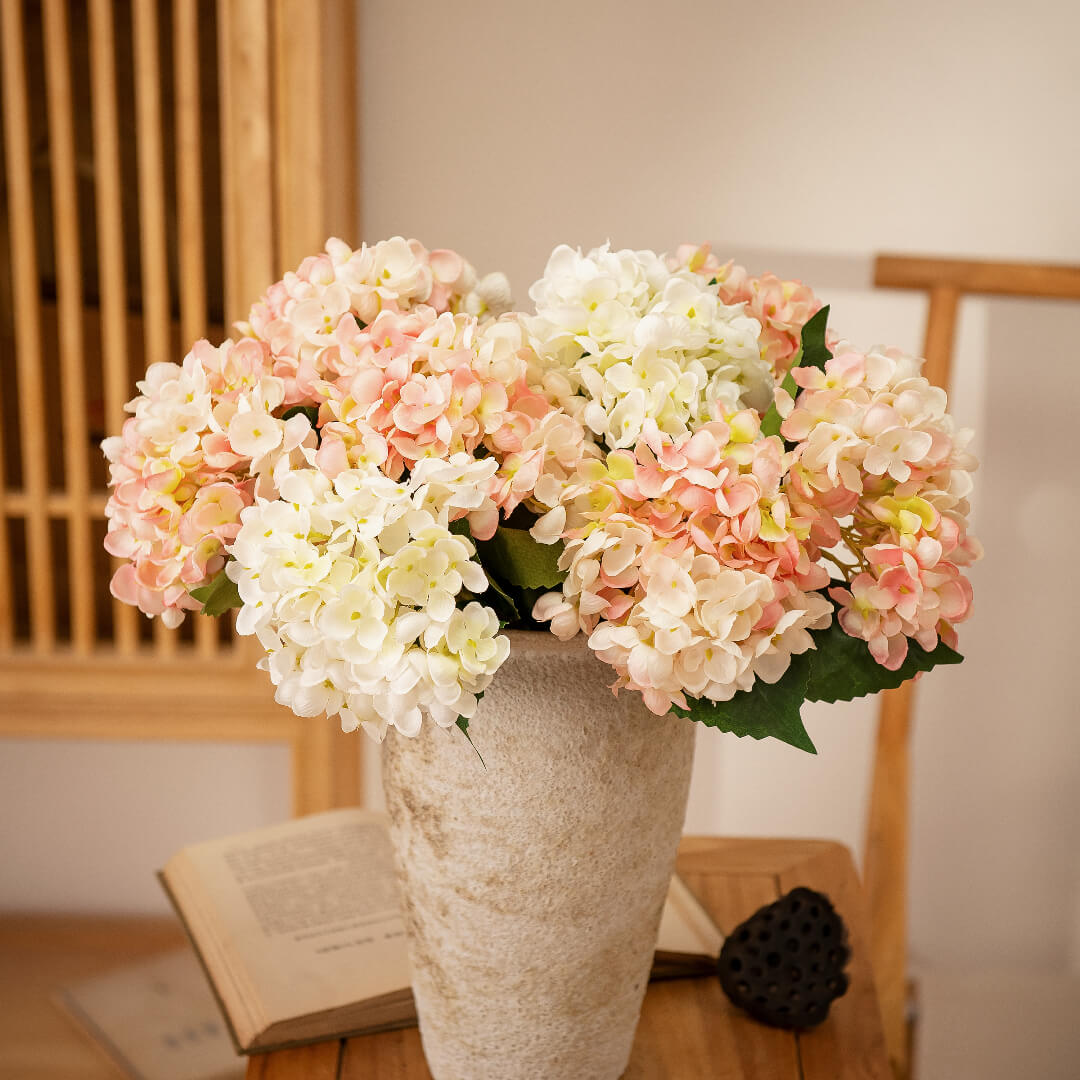 Hydrangea arrangement in vase, elegant and graceful.
