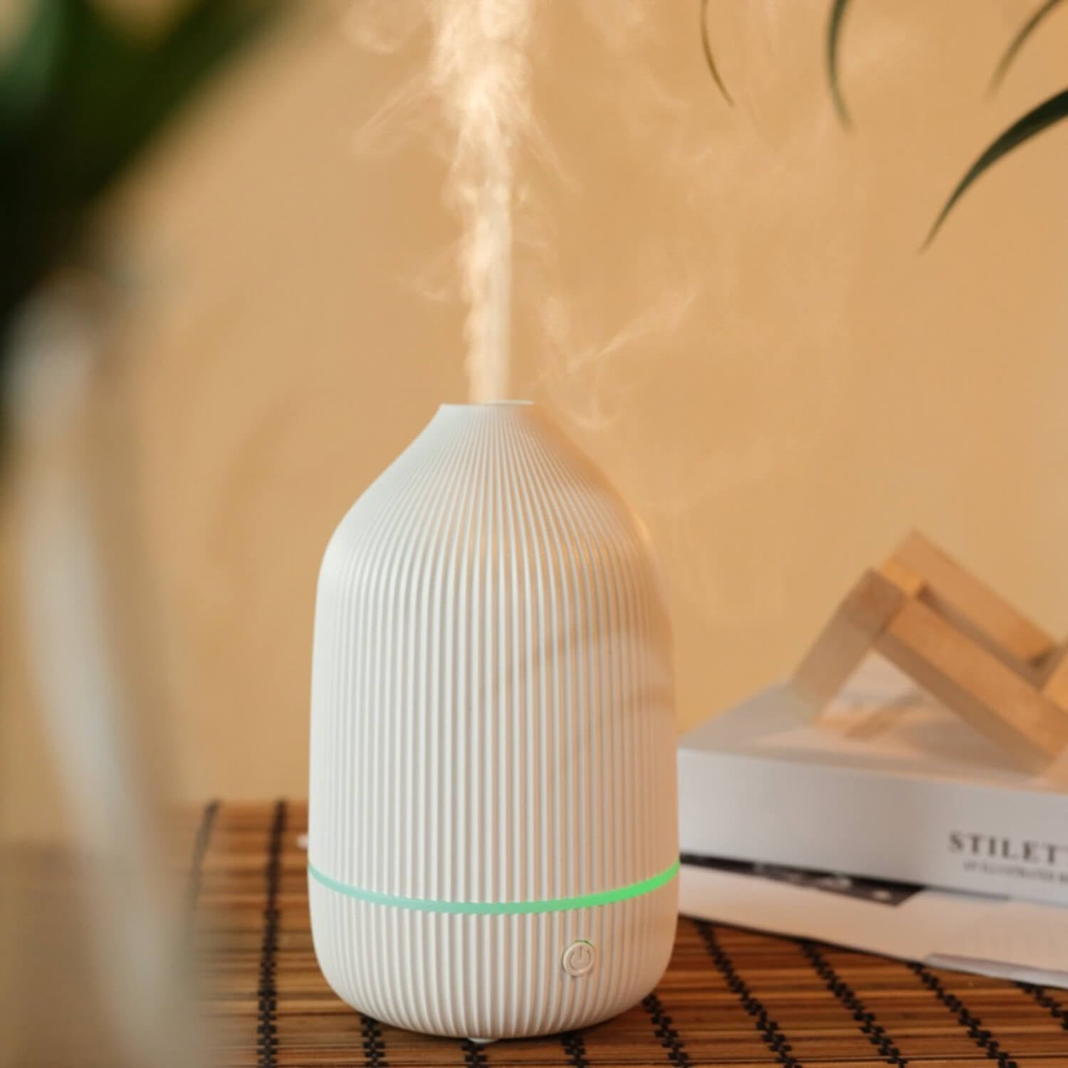 Enhance your space with the elegant Wood-Texture Oil Diffuser. Experience soothing aromatherapy in style.