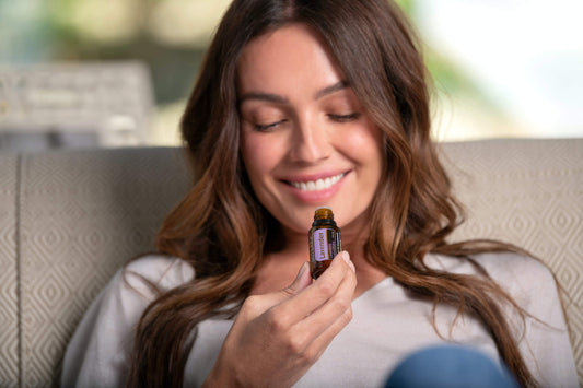 A woman is enjoying aromatherapy, immersed in a serene environment surrounded by soothing fragrances.