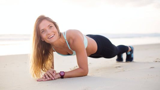 A woman practicing yoga by the seaside, enjoying the tranquil setting and serene atmosphere.