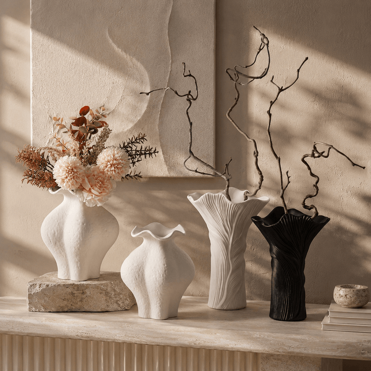 Sculptural ceramic vase collection displayed in a warm editorial home setting