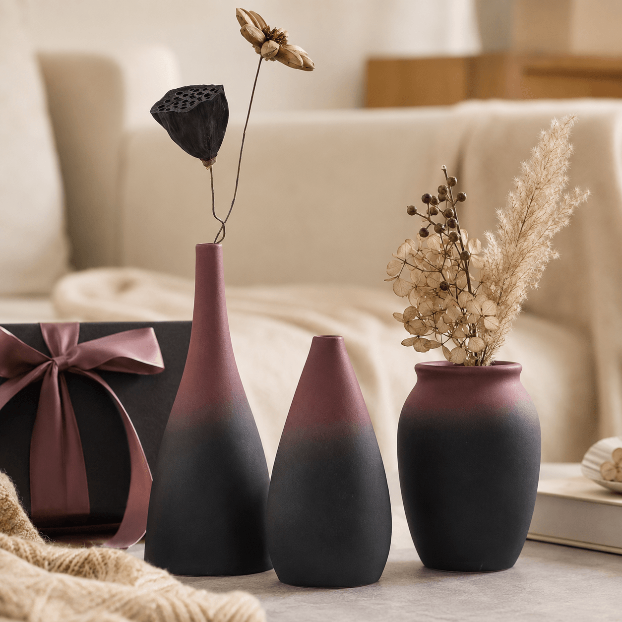 Mauve and charcoal ceramic vase gift set styled with dried flowers in a cozy home scene