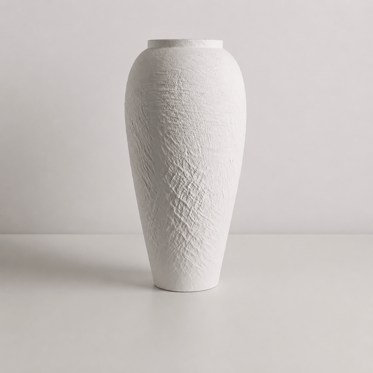 Large white textured decorative vase without flowers