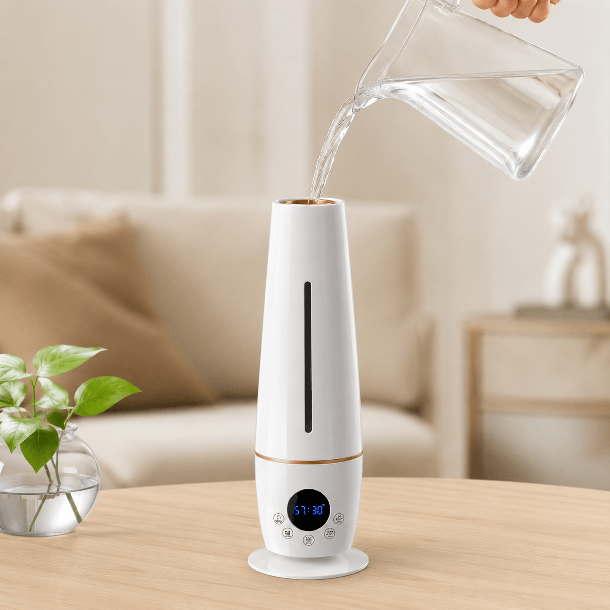 Top-fill 5L cool mist humidifier being refilled with water on a wooden table.