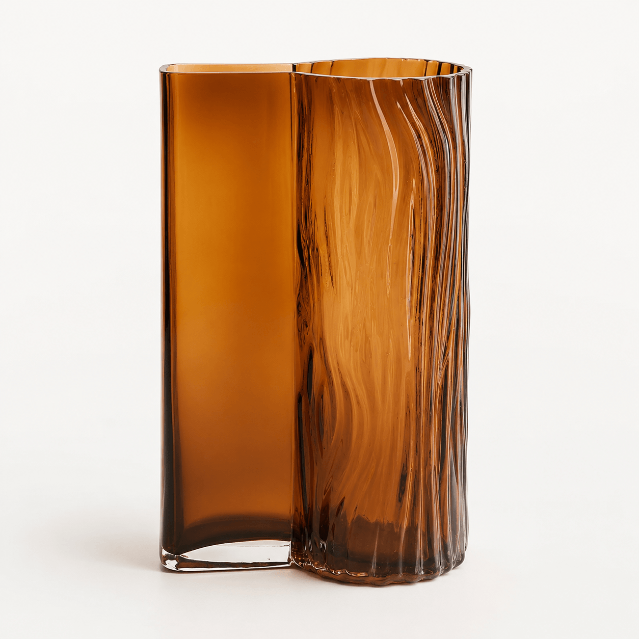Amber textured glass vase with asymmetrical silhouette on a clean background