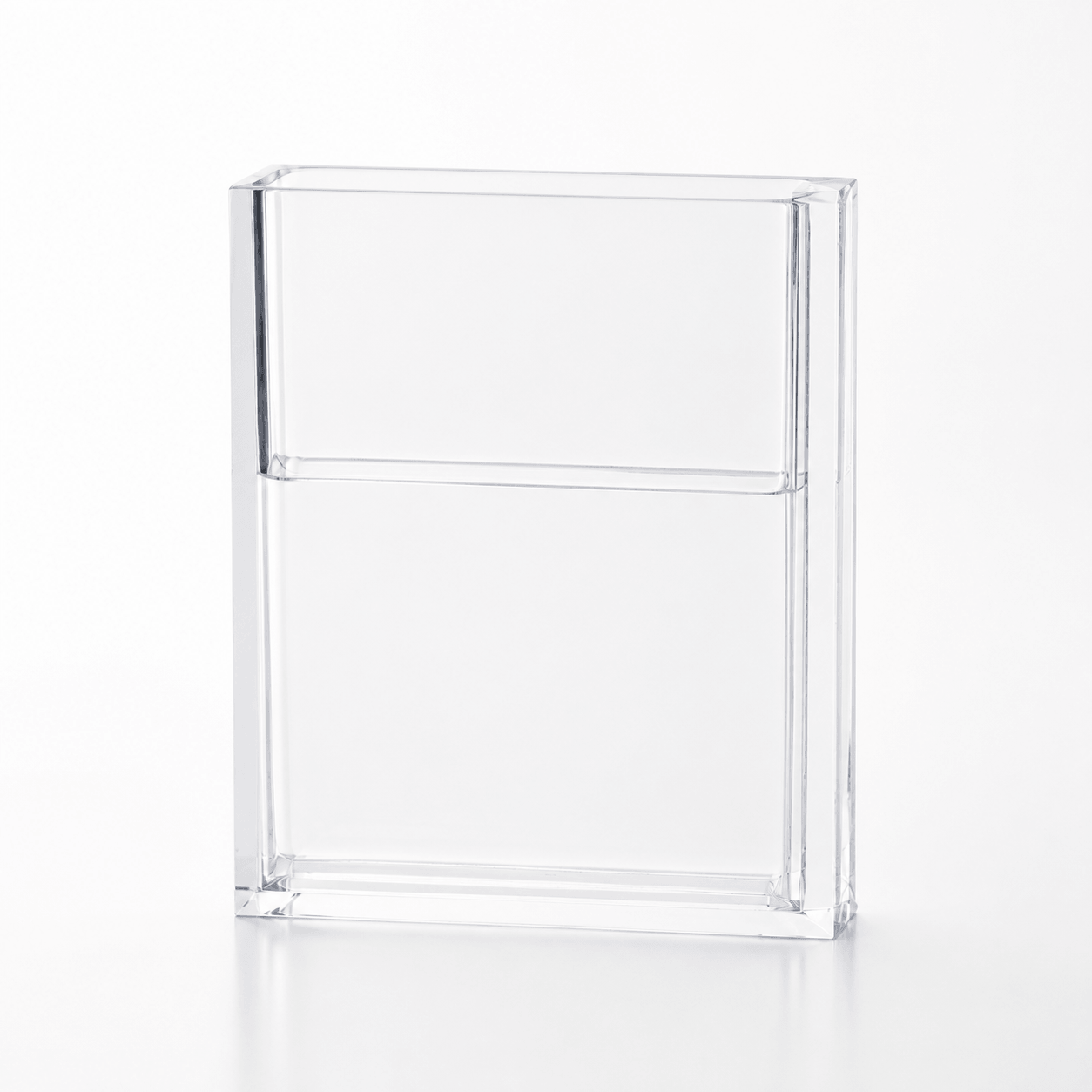 Empty clear acrylic book vase showing the transparent book-shaped design.