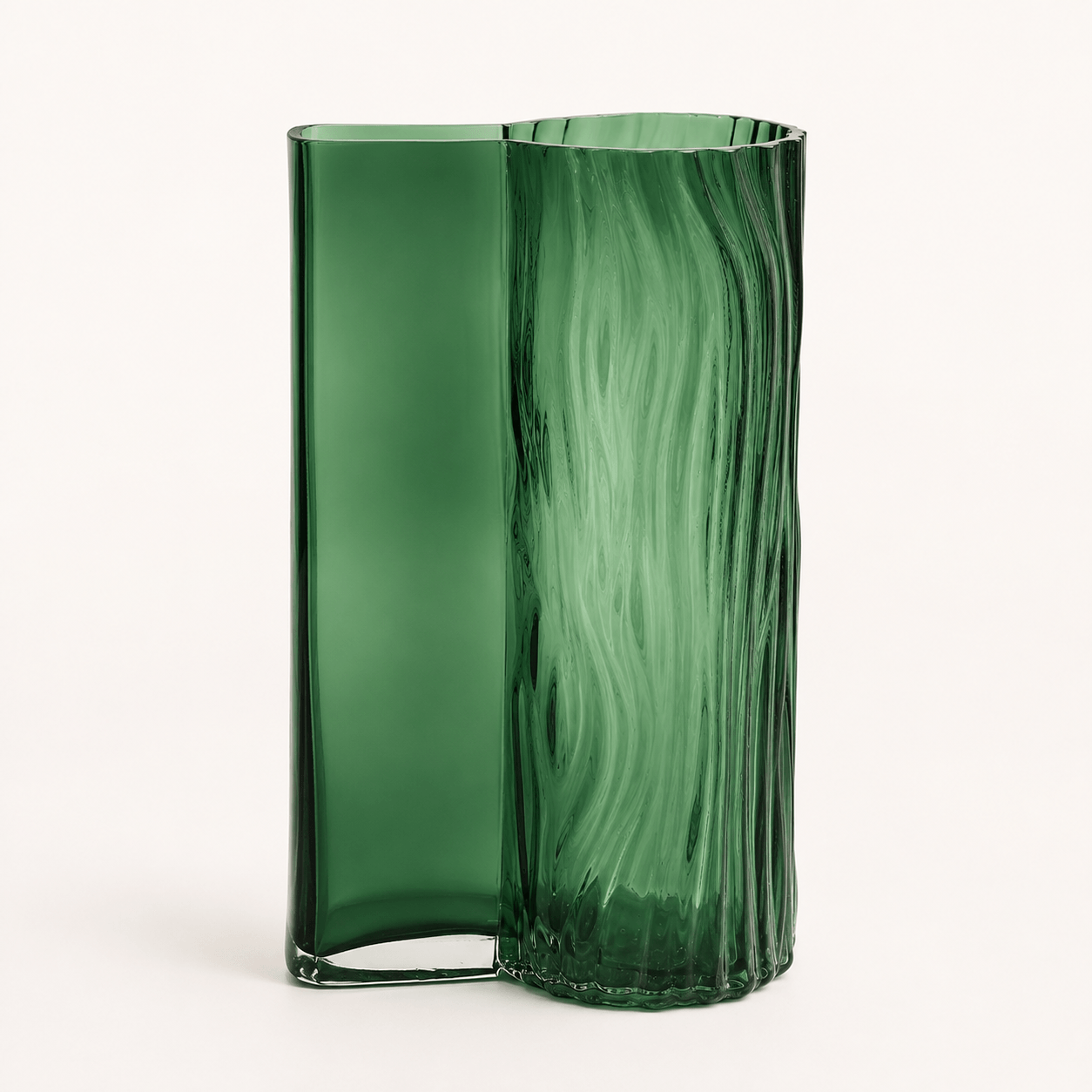Emerald green textured glass vase with decorative art glass design on a clean background