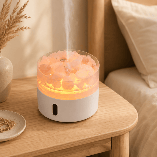 Himalayan salt stone diffuser glowing softly on a bedside table.