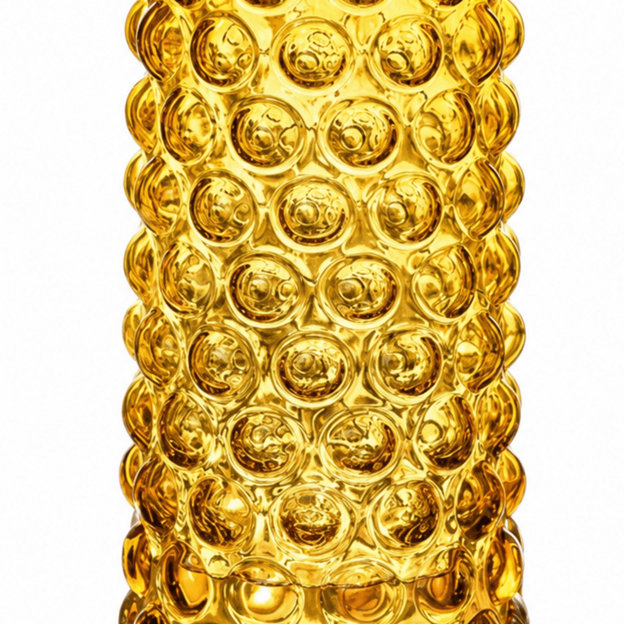 Close-up of raised circular bubble texture on an amber glass vase