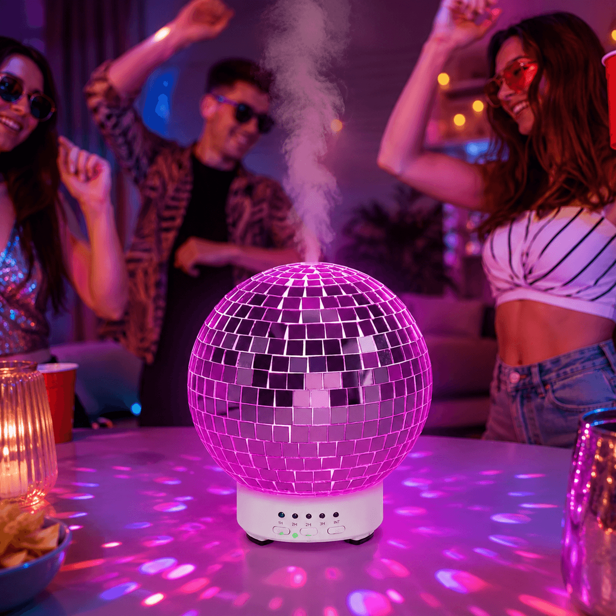Pink disco ball humidifier creating a fun party atmosphere with soft mist