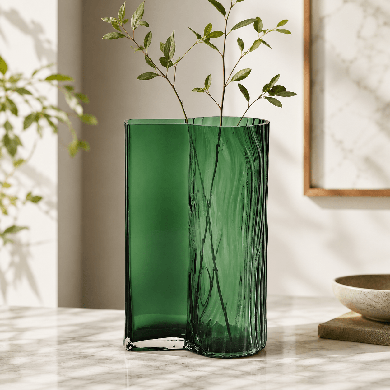 Emerald green decorative glass vase styled in a modern living room setting
