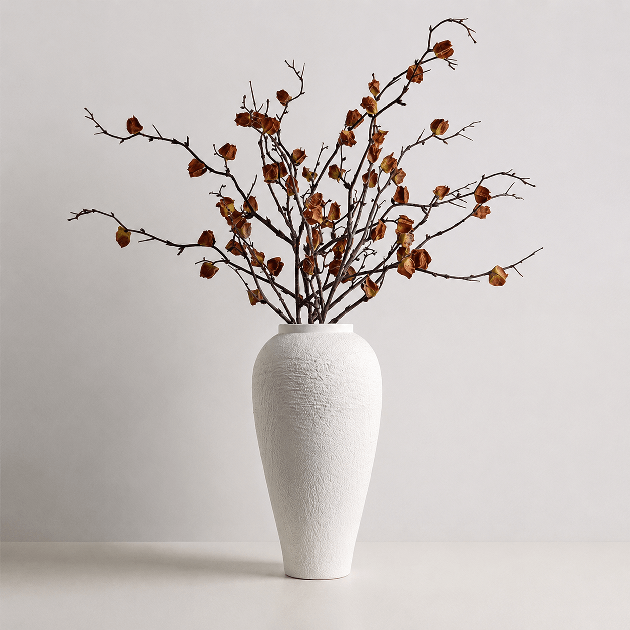 White textured vase styled with dried brown branches