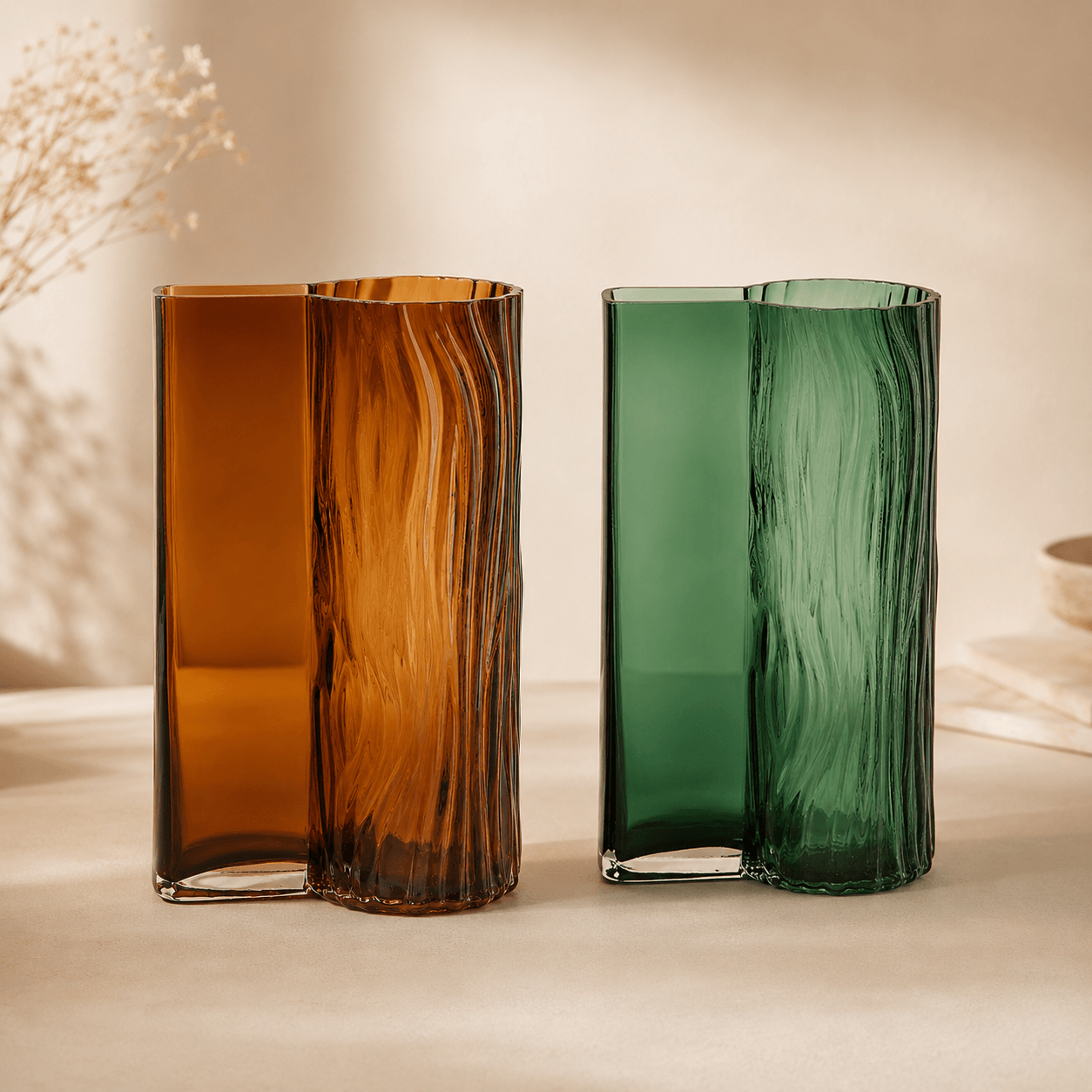 Amber and emerald green textured glass vases displayed together