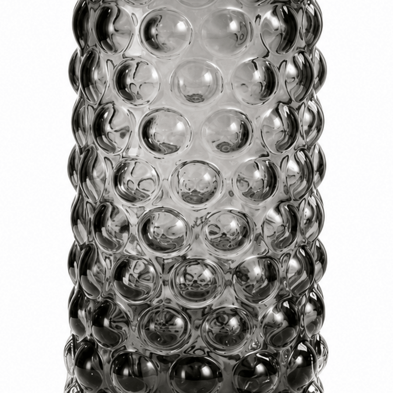 Close-up of raised circular bubble texture on a smoke gray glass vase