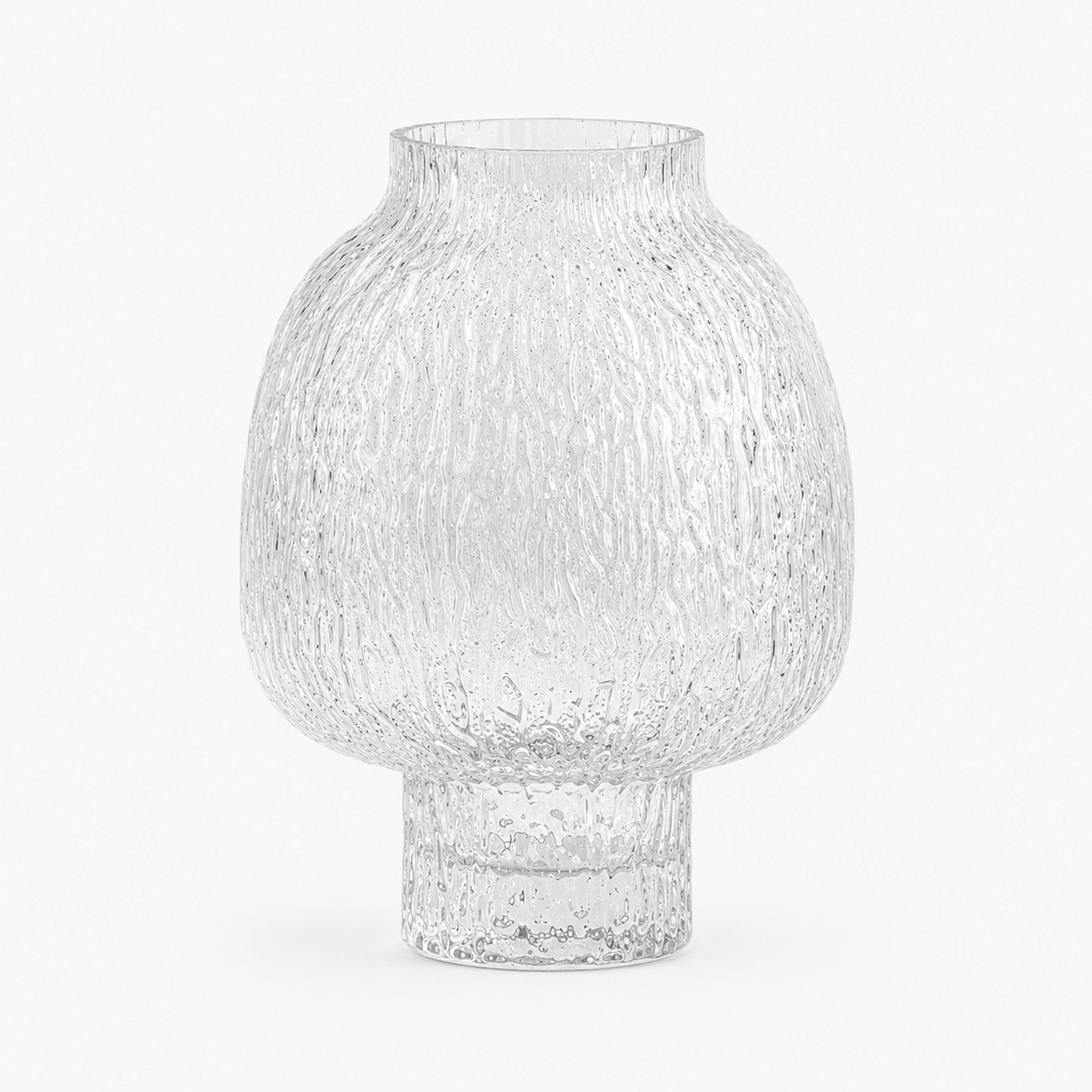 Clear textured glass vase with rounded body and pedestal base on a clean white background