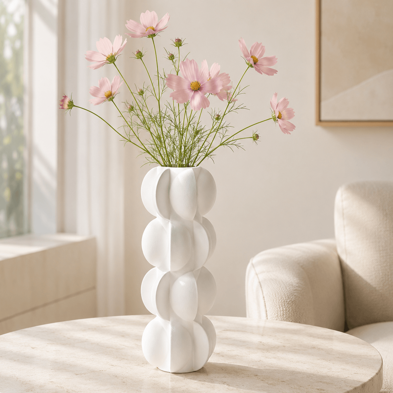Soft White Sculptural Bubble Ceramic Vase styled with pink cosmos flowers on a modern coffee table