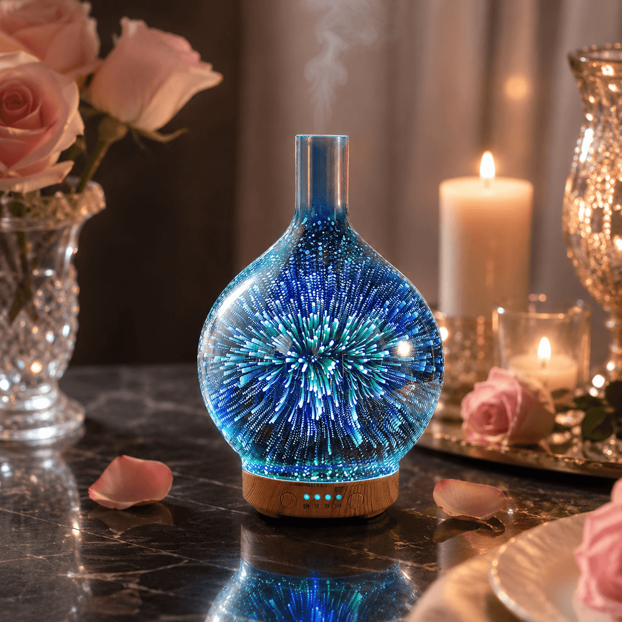 Blue glass firework aroma diffuser with soft glow beside flowers and candlelight
