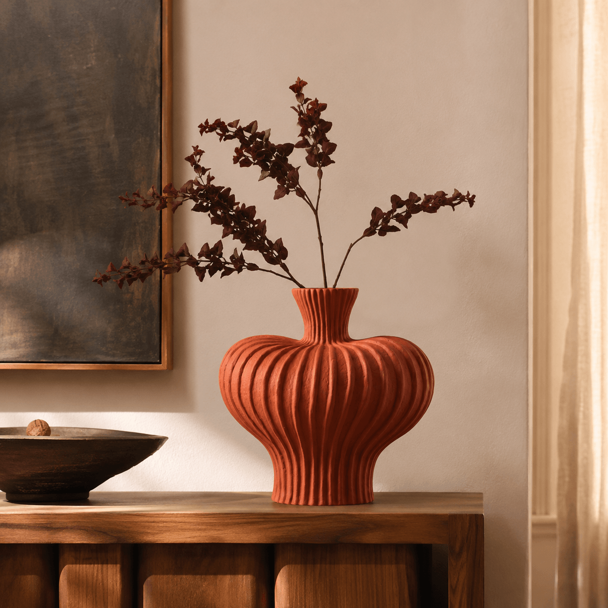 Terracotta Red ribbed ceramic vase on a wooden console as a statement home decor piece