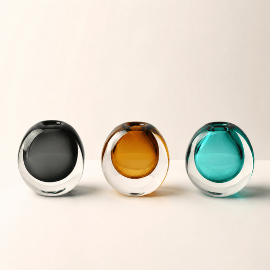 Dark Gray, Amber, and Peacock Blue color spectrum glass vases displayed together on a clean background.
