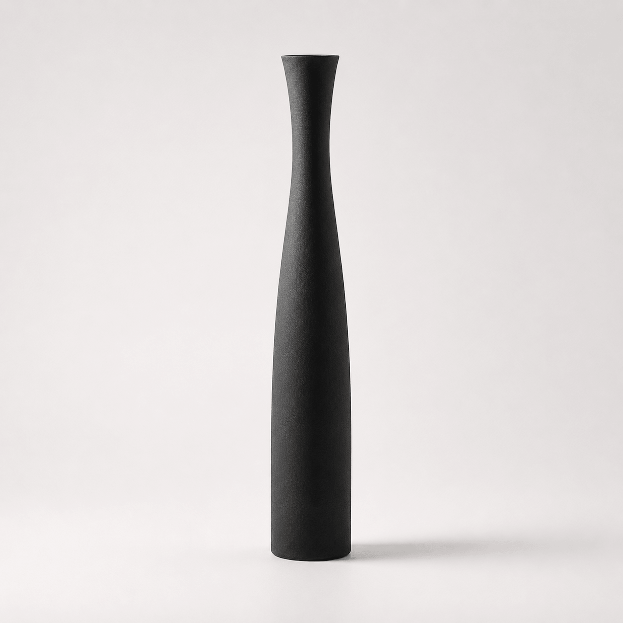 Large matte black ceramic vase with a tall slim silhouette for modern minimalist decor.