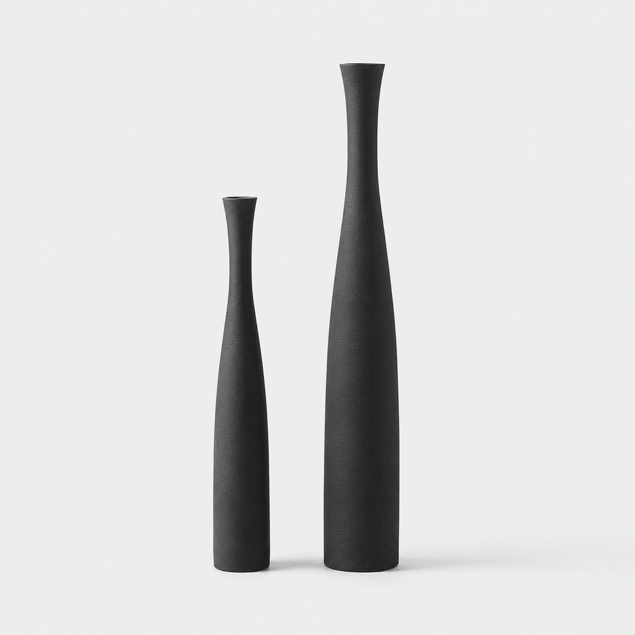 Matte black ceramic vase set with large and small vases for minimalist styling.