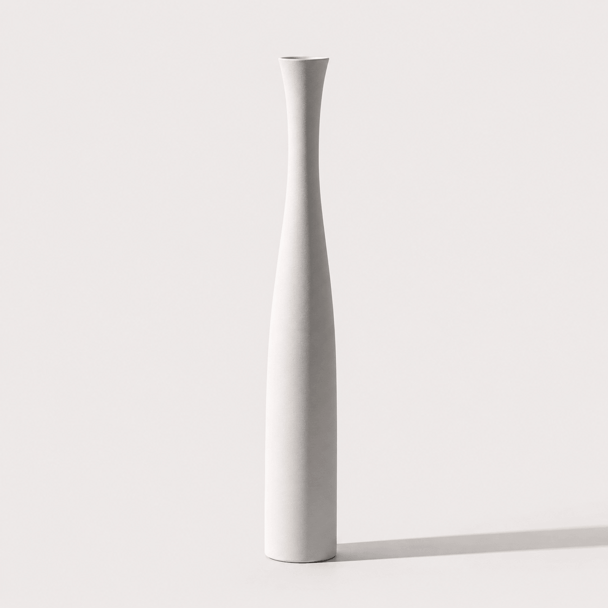 Large pearl white ceramic vase with a tall slender shape for modern interior styling.