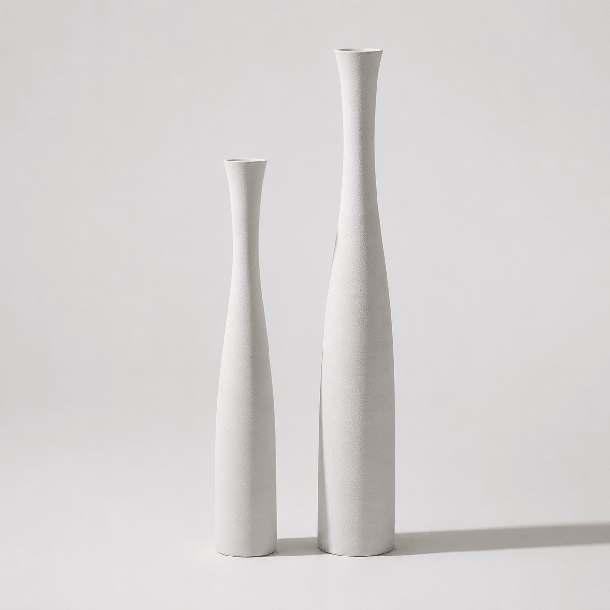 Pearl white ceramic vase set with large and small vases for clean modern decor.
