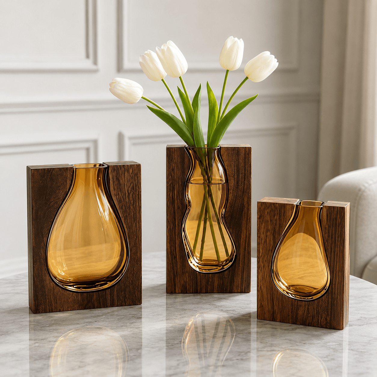 Sculptural amber glass wooden frame vase set with white tulips for modern interior decor.